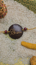Load image into Gallery viewer, Coconut Shell Rakhi - Bhai (English)

